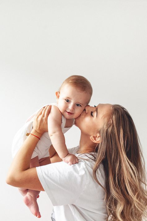 Mother loving her infant ,showing affection and care.